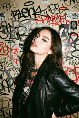 Petra - LADDER STITCH FLOWING BLOUSE + 50TH ANNIVERSARY LEATHER TROUSERS WITH DARTS AND BELT - Punk Graffiti Wall Flash [Rotated 40° Right]