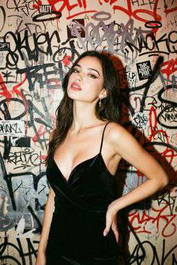 Petra - CONTRAST LACE BRALETTE + 50TH ANNIVERSARY WOOL BLEND TROUSERS - Punk Graffiti Wall Flash [Rotated 20° Right]